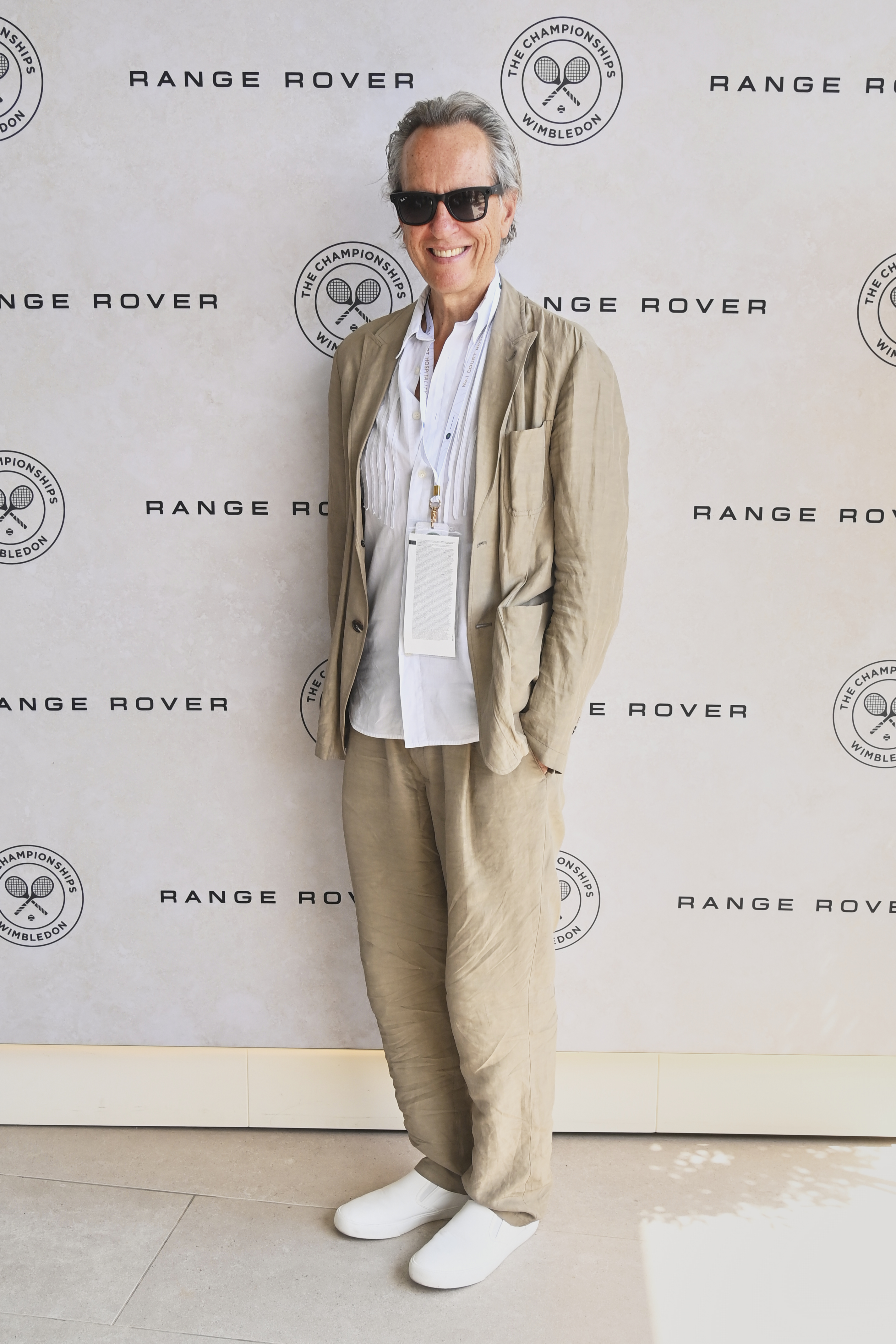 Richard E Grant wears a linen suit set.