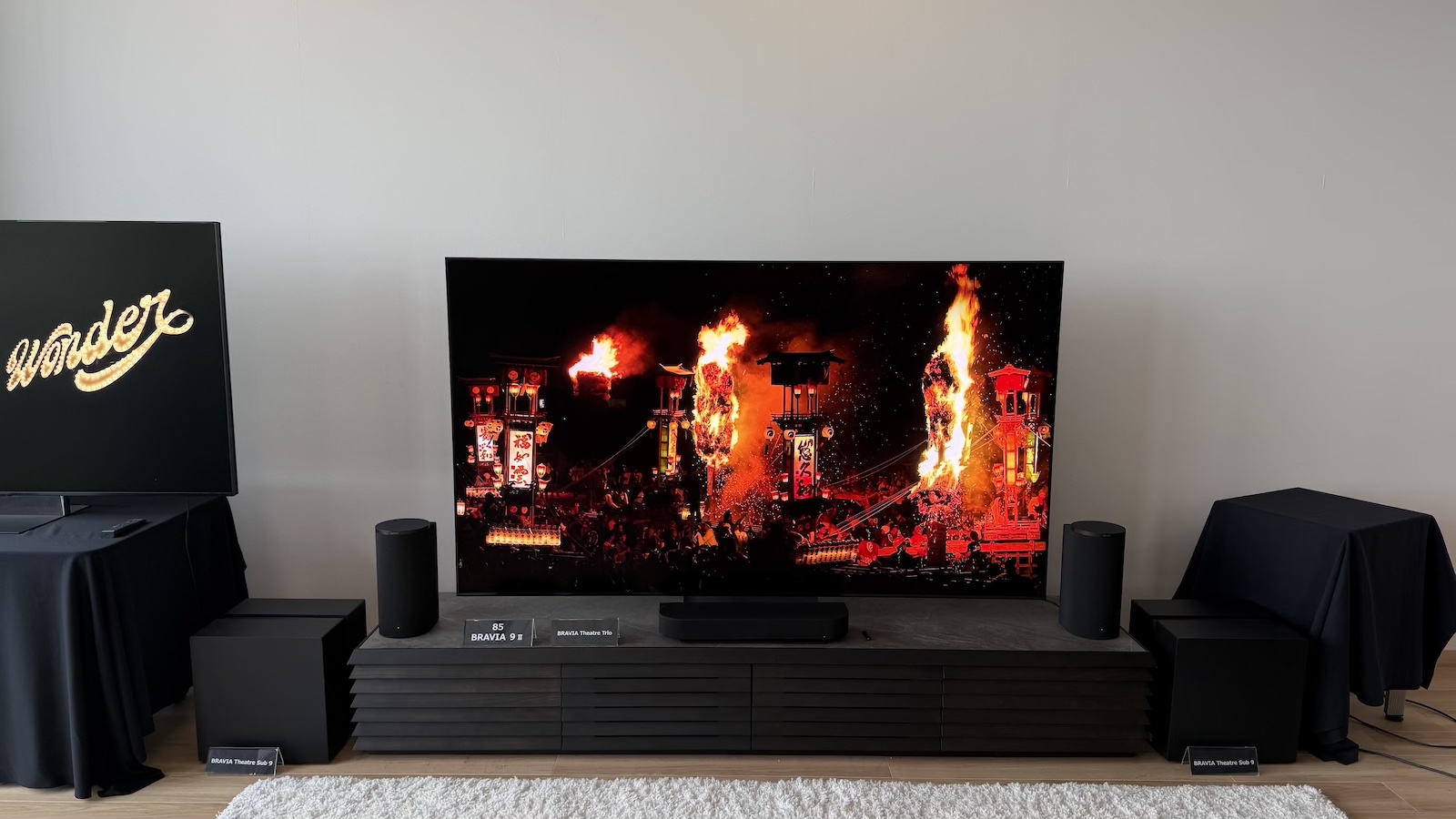 The Sony Bravia 9 II TV and Bravia Theatre Trio speaker system, photographed on a low AV stand