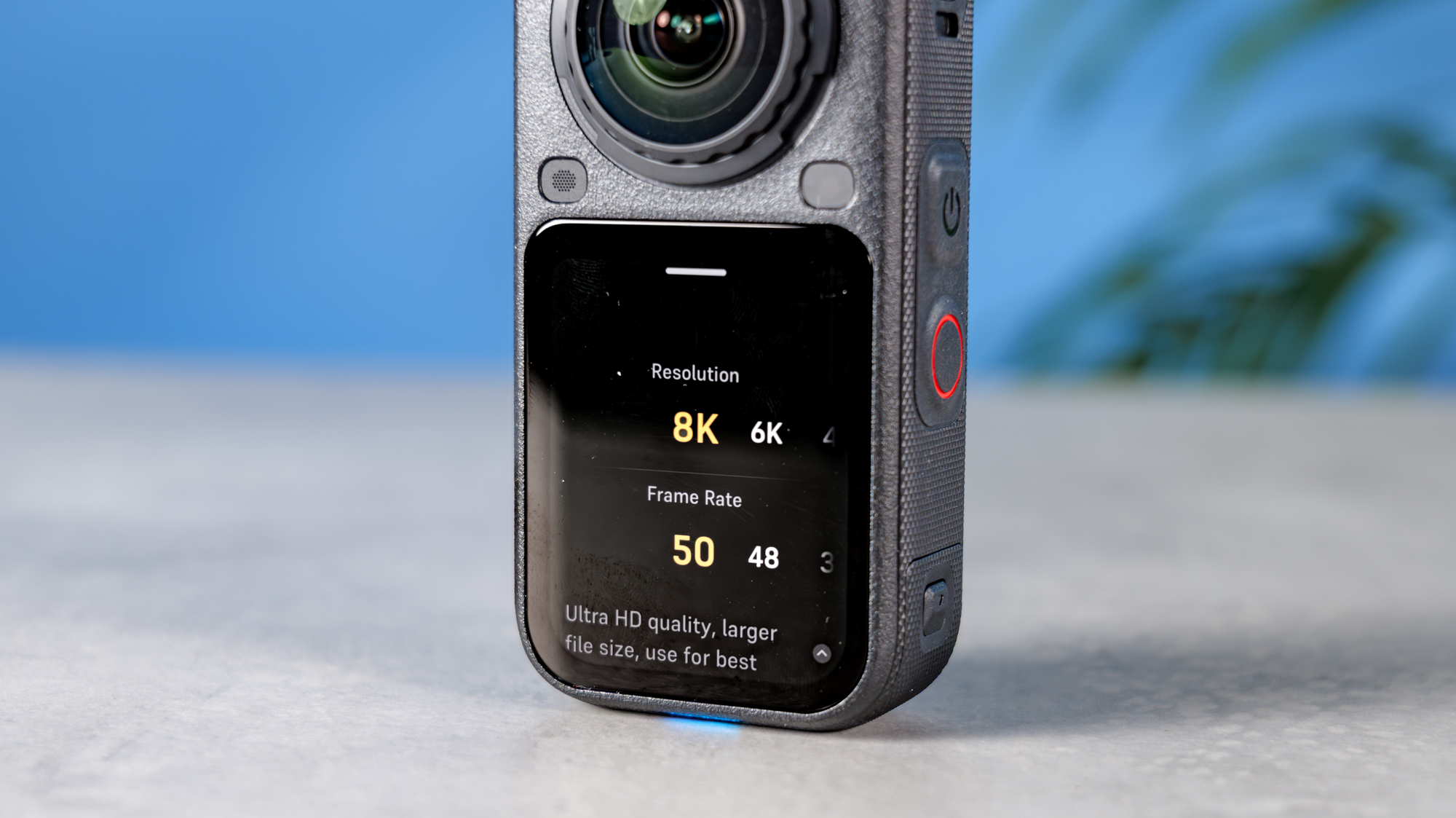 A photo of the Insta360 X6 on a stone surface with the 8K resolution and 50fps frame rate being selected