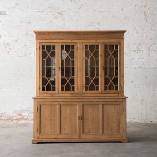 A wooden and glass buffet from Magnolia