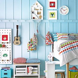 children room with light blue and pillow