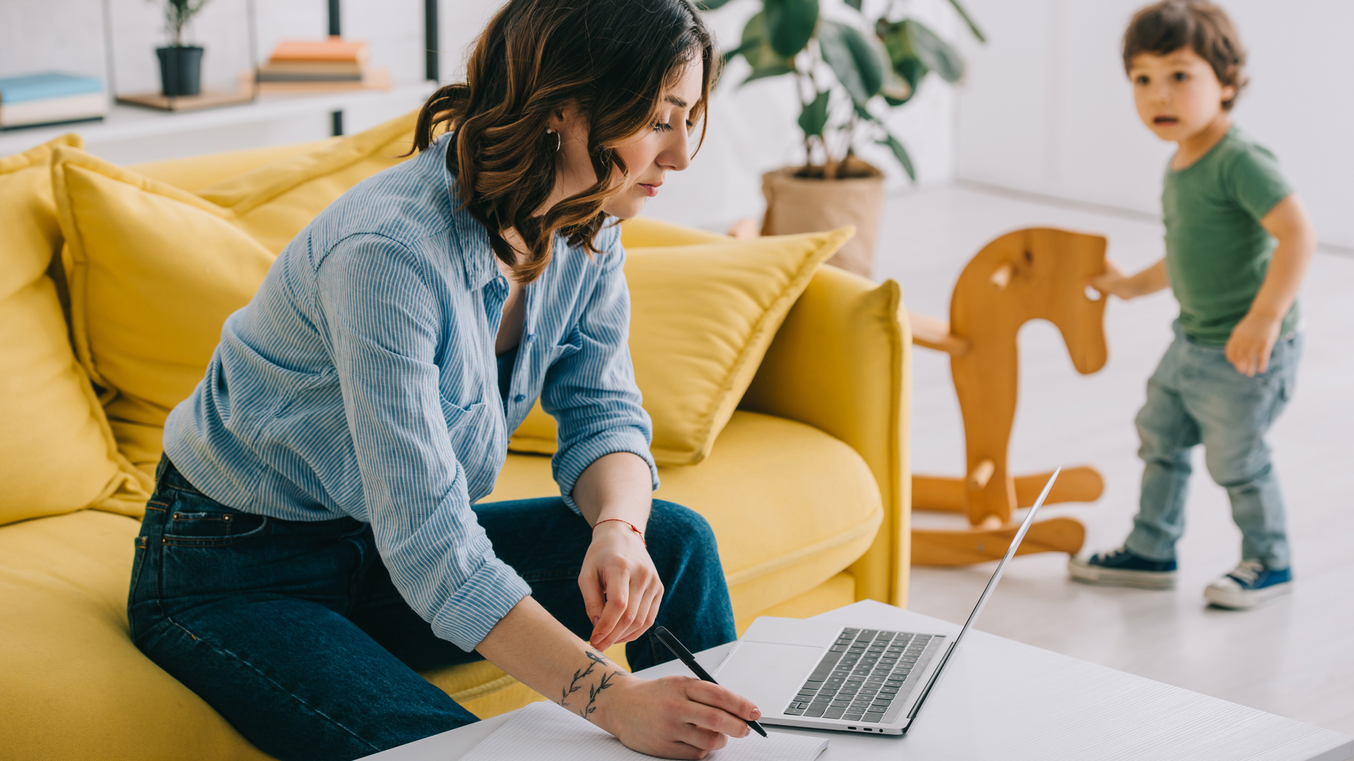 woman working from home with child