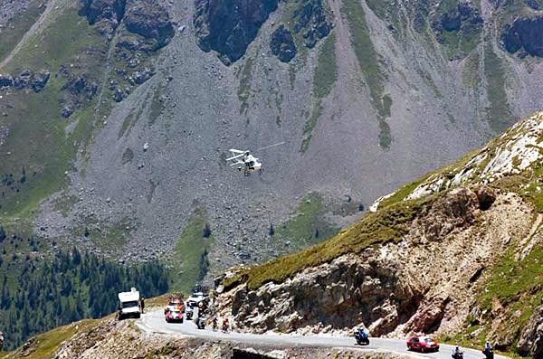A helicopter follows the leaders on the Galibier