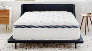 The WinkBed mattress in a white bedroom