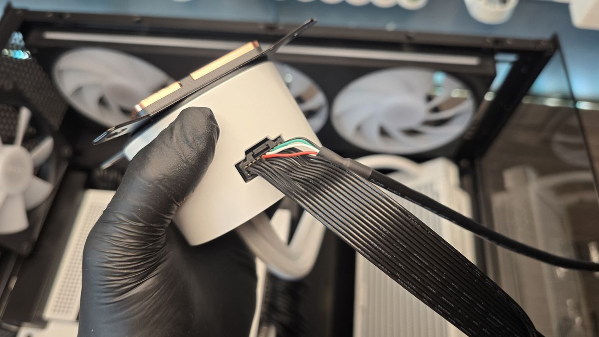 The NZXT Kraken Plus 360 RGB liquid cooler installed in a test bench.
