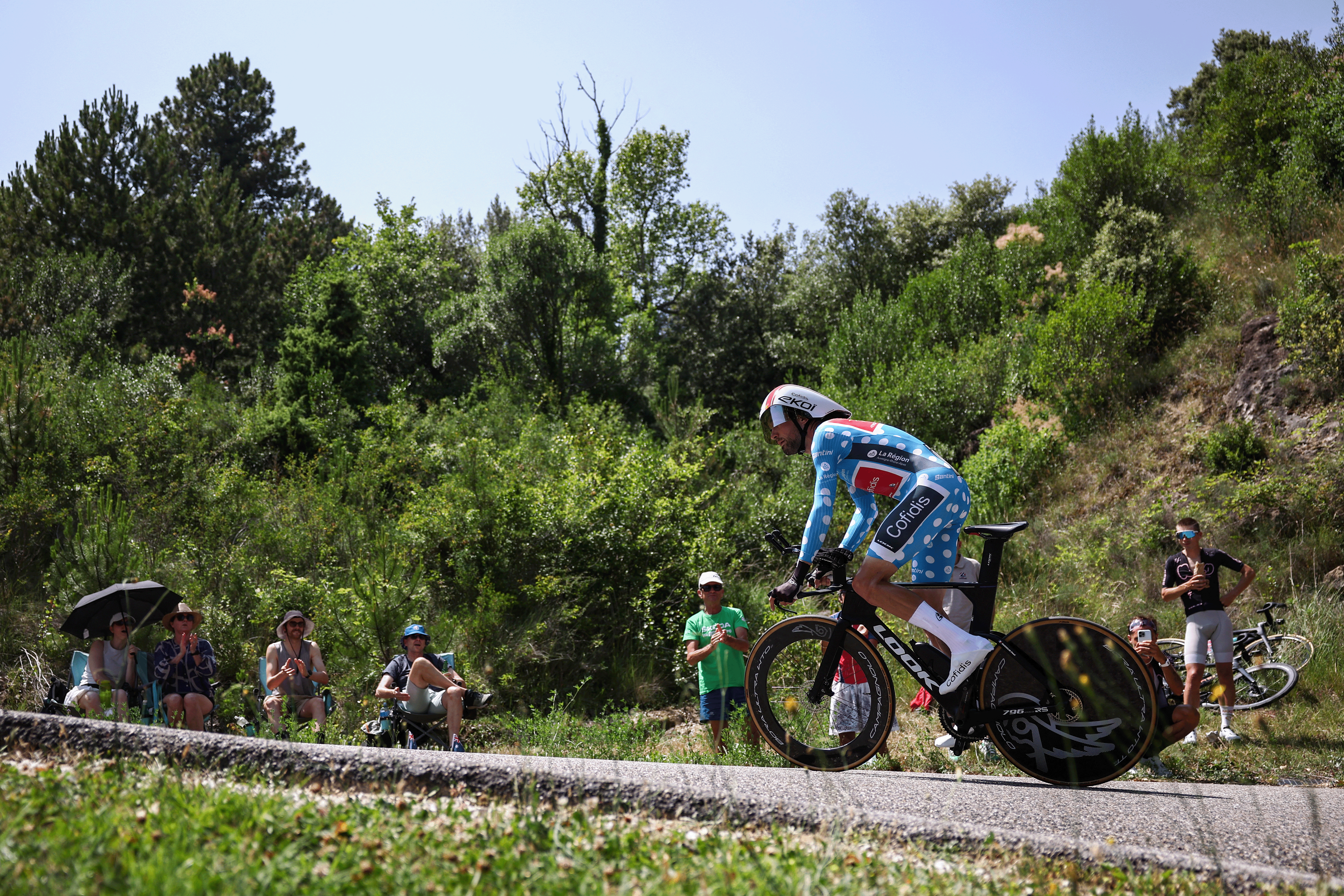 Cofidis's French rider Paul Ourselin wearing the climber's dotted jersey cycles during the 4th stage of the 77th edition of the Criterium du Dauphine cycling race, a 17,4 km individual time trial between Charmes-sur-Rhône and Saint-Péray, on June 11, 2025. (Photo by Anne-Christine POUJOULAT / AFP) (Photo by ANNE-CHRISTINE POUJOULAT/AFP via Getty Images)