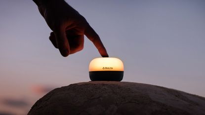 BioLite AlpenGlow Mini Lantern in use in a camping setting