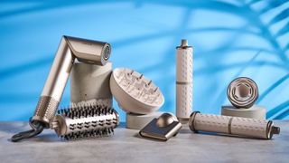 Dreame Dazzle air styler photographed in front of a blue background