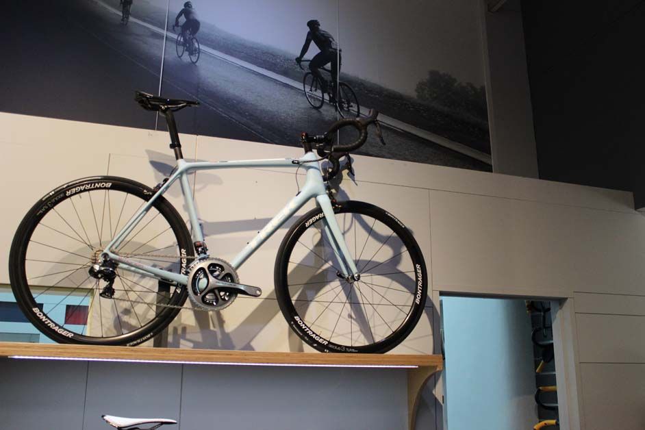 A Trek Emonda sits just above the entrance to the workshop