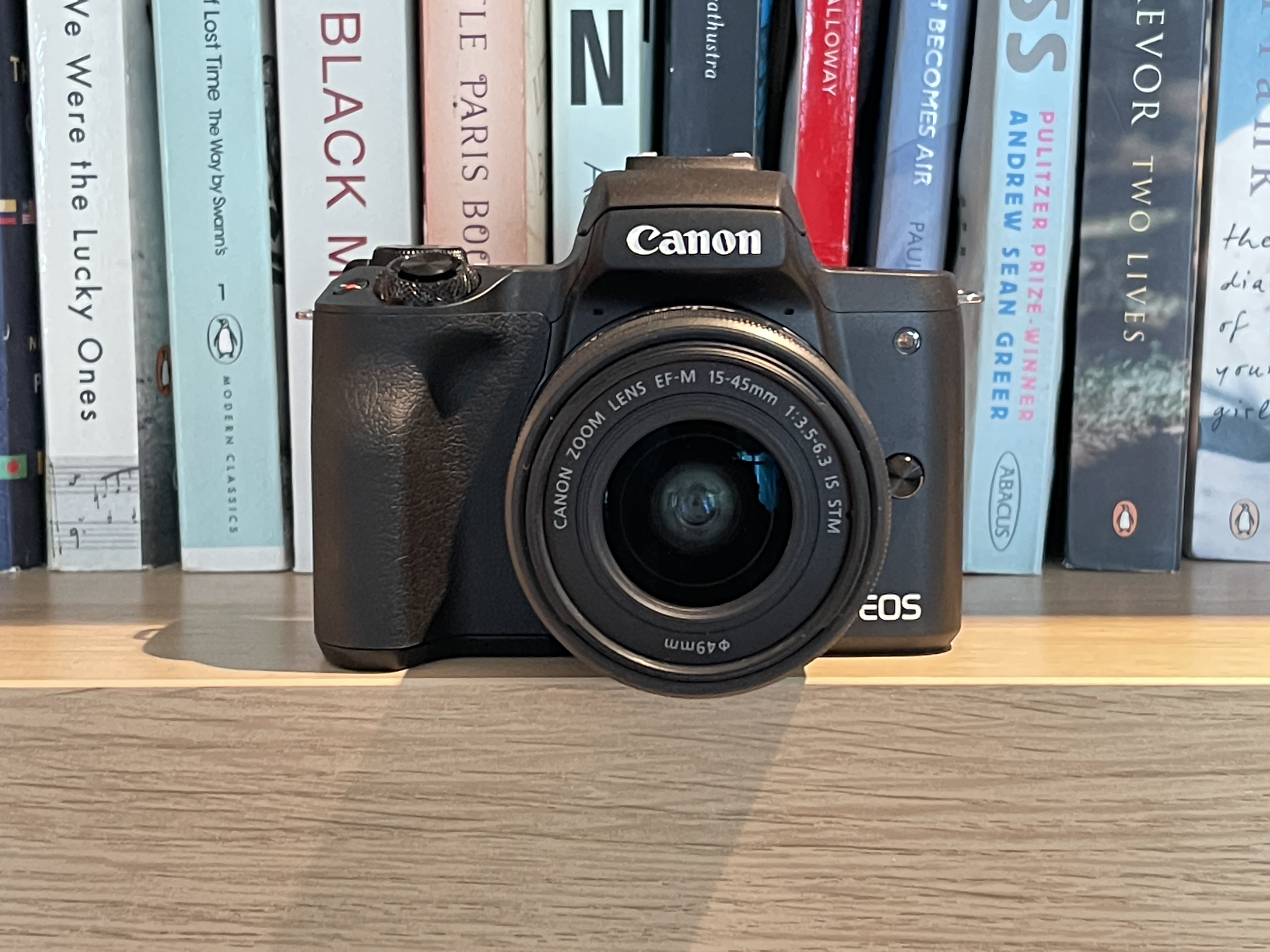 Canon EOS M50 Mark II, one of the best Canon cameras, sitting on a bookshelf