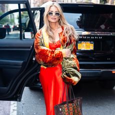 Jessica Simpson wearing oversized sunglasses and a matching set