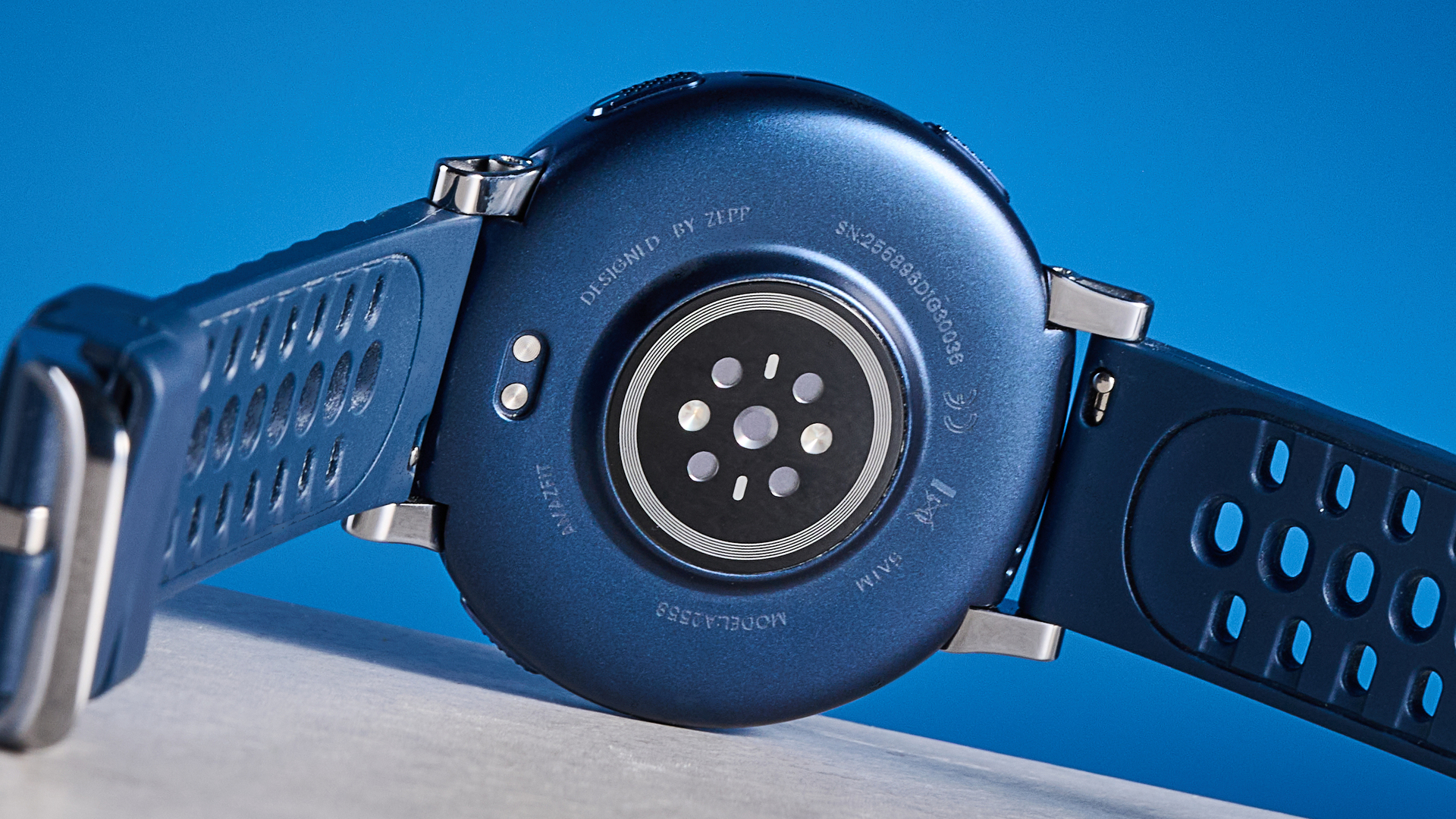 the amazfit active 3 premium photographed against the blue tom's guide background