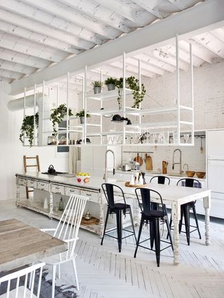 White industrial style kitchen with kitchen island