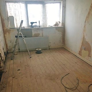unused box room with wooden floor