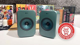 KEF LSX II LT in green on a white desk 