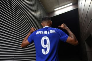 Pierre-Emerick Aubameyang poses for a photograph as he signs for Chelsea at Chelsea Training Ground on September 01, 2022 in Cobham, England.