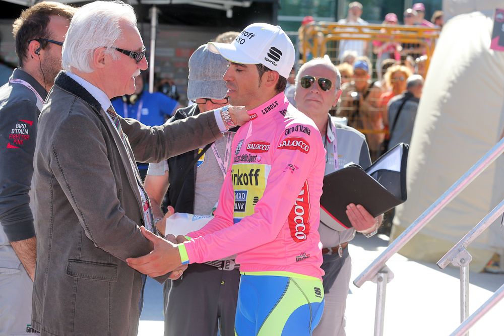 Alberto Contador waits for his podium appearance.