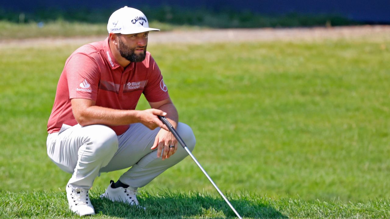 Jon Rahm ines up a putt on the 13th hole during the final round of the BMW Championship.