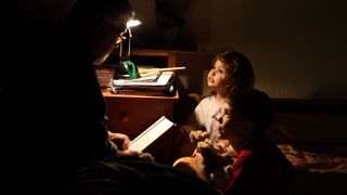 This photo by Gábor Varga in Pécs, Hungary, captures the joy and wonder of a bedtime story.