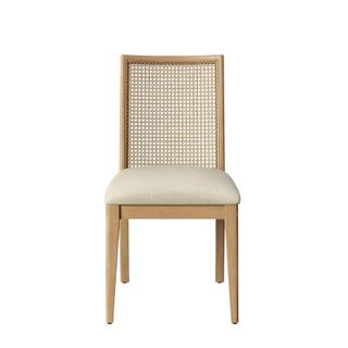 A dining room chair with cane back