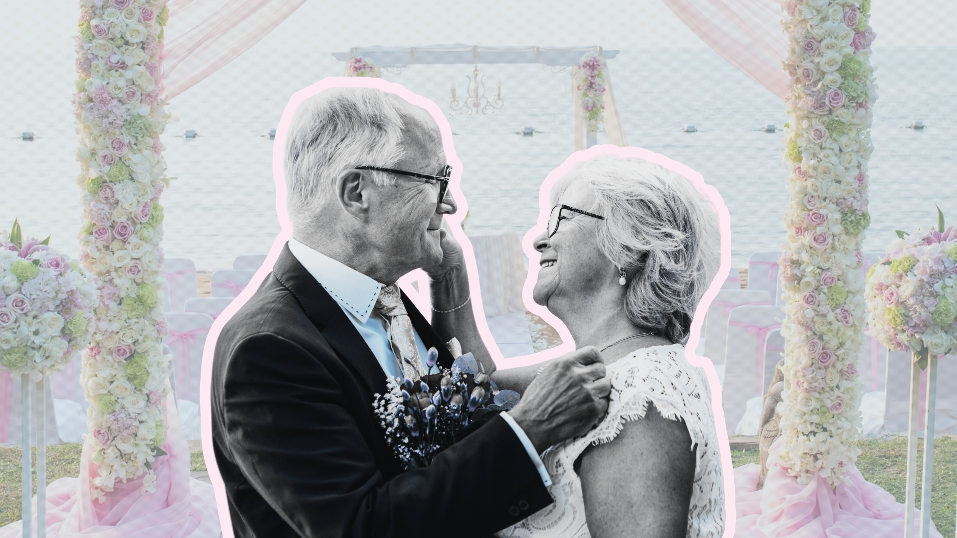 Older couple with wedding graphic backdrop