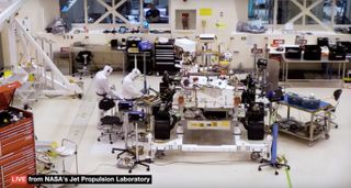 Technicians work on NASA's 2020 Mars rover at the Jet Propulsion Laboratory in Pasadena, California, on June 14, 2019. In this image, which is a screenshot from NASA's "Seeing 2020" livestream, the rover's first set of wheels is clearly visible. These wheels will be replaced by the flight models after the rover makes it to its Florida launch site.