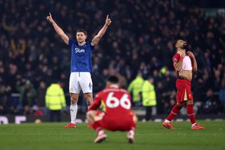 James Tarkowski celebrates his late equaliser for Everton against Liverpool in February 2025 as Reds pair Mohamed Salah and Trent Alexander-Arnold look dejected.