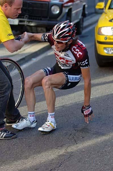 A neutral hand helps Schleck get up, but it's all over for the Luxemburger.