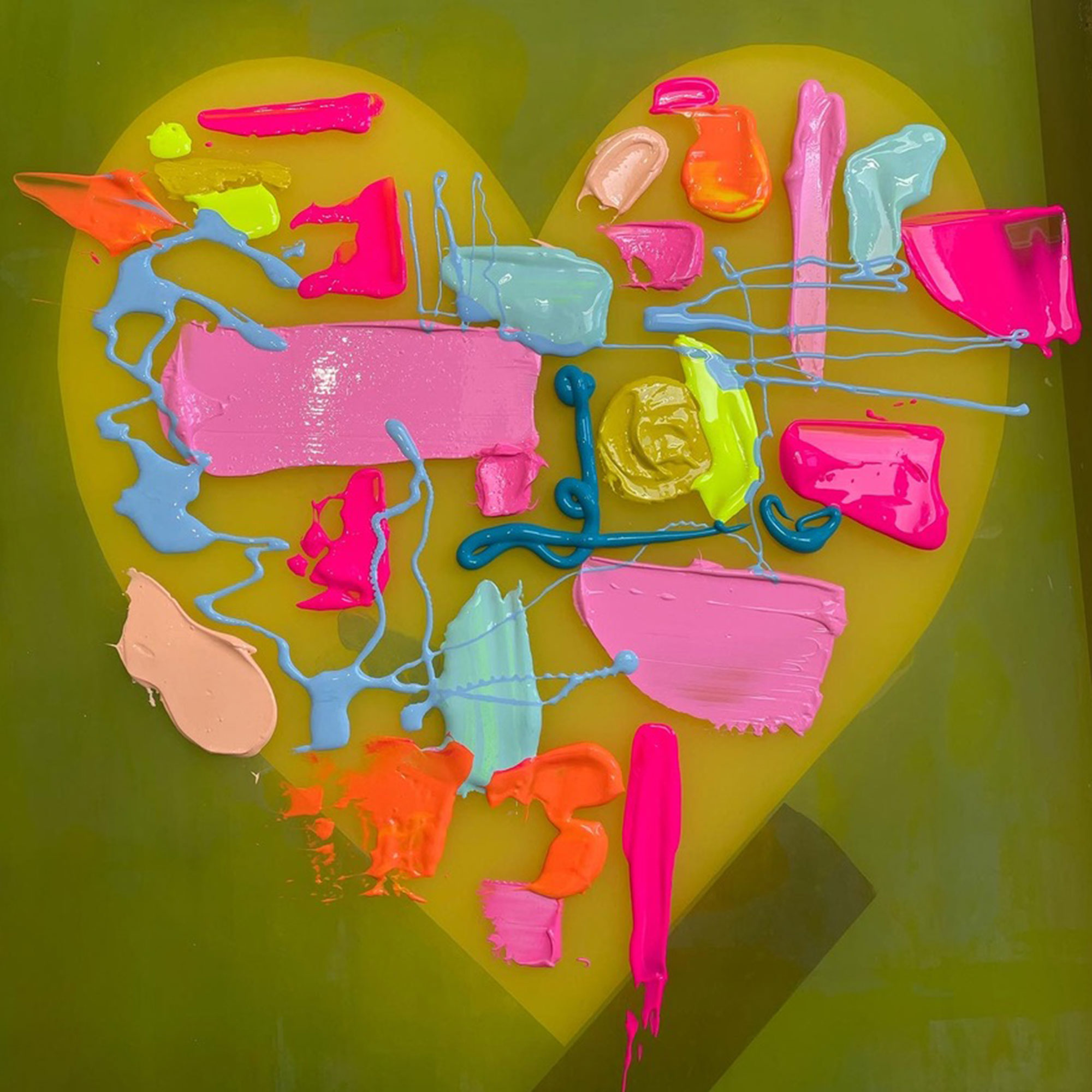 Green heart with blobs and splashes of paint on it