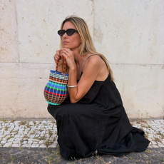 @helenacanadas wears black maxi dress statement bag