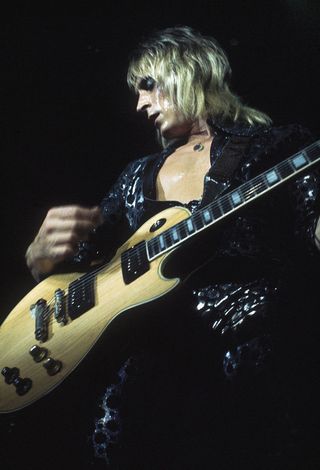 Mick Ronson (1945 - 1993) performing with David Bowie and his band (as Ziggy Stardust and The Spiders From Mars) at the Hammersmith Odeon, 1973.