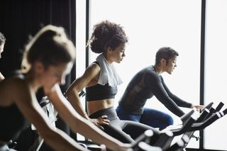 A group of people in a spin class.