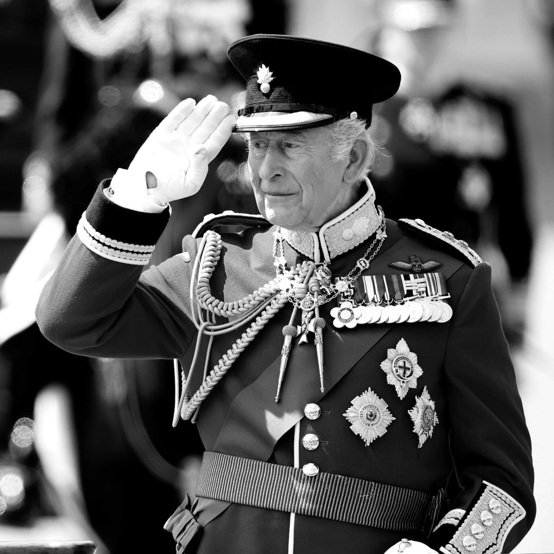 King Charles saluting in a military uniform