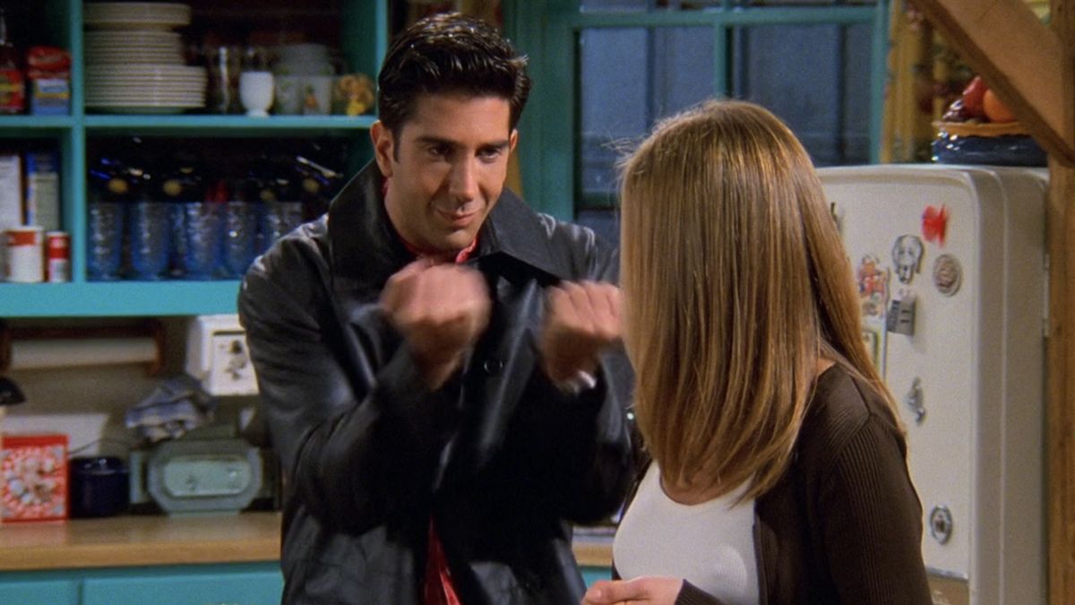 Ross pounding his fists together at Rachel in Friends