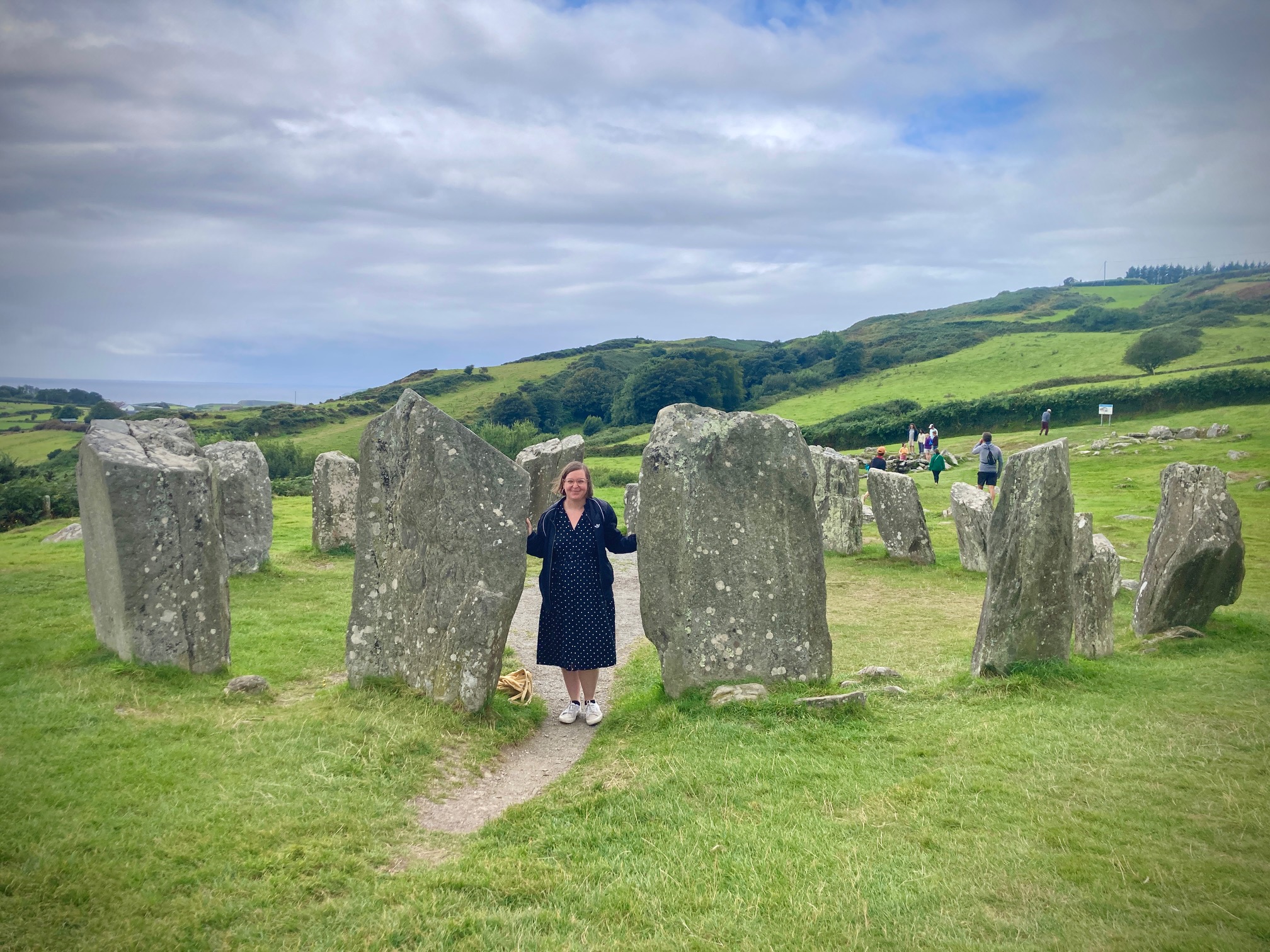 woman in the middle of a stone circle