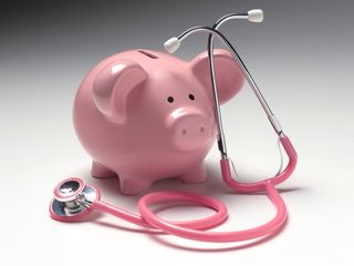 Piggy bank and stethoscope illustrating medical insurance