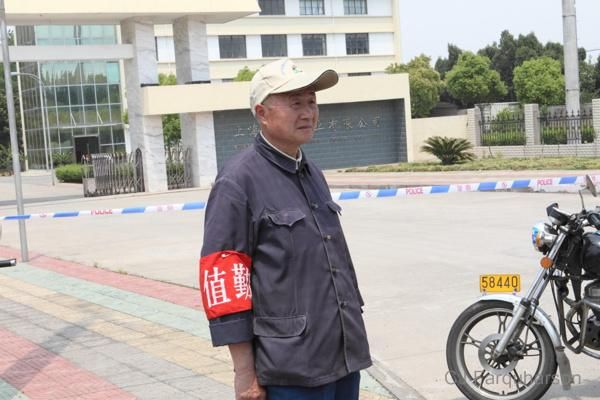A Chinese worker from a local factory, wearing a World Cup cap