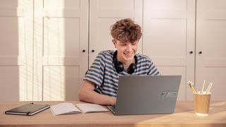 Asus' new laptops in use by a young woman