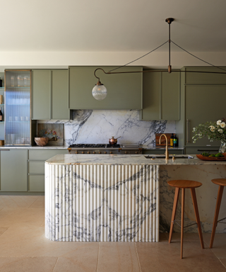 Modern style kitchen with pale green and grey veined marble