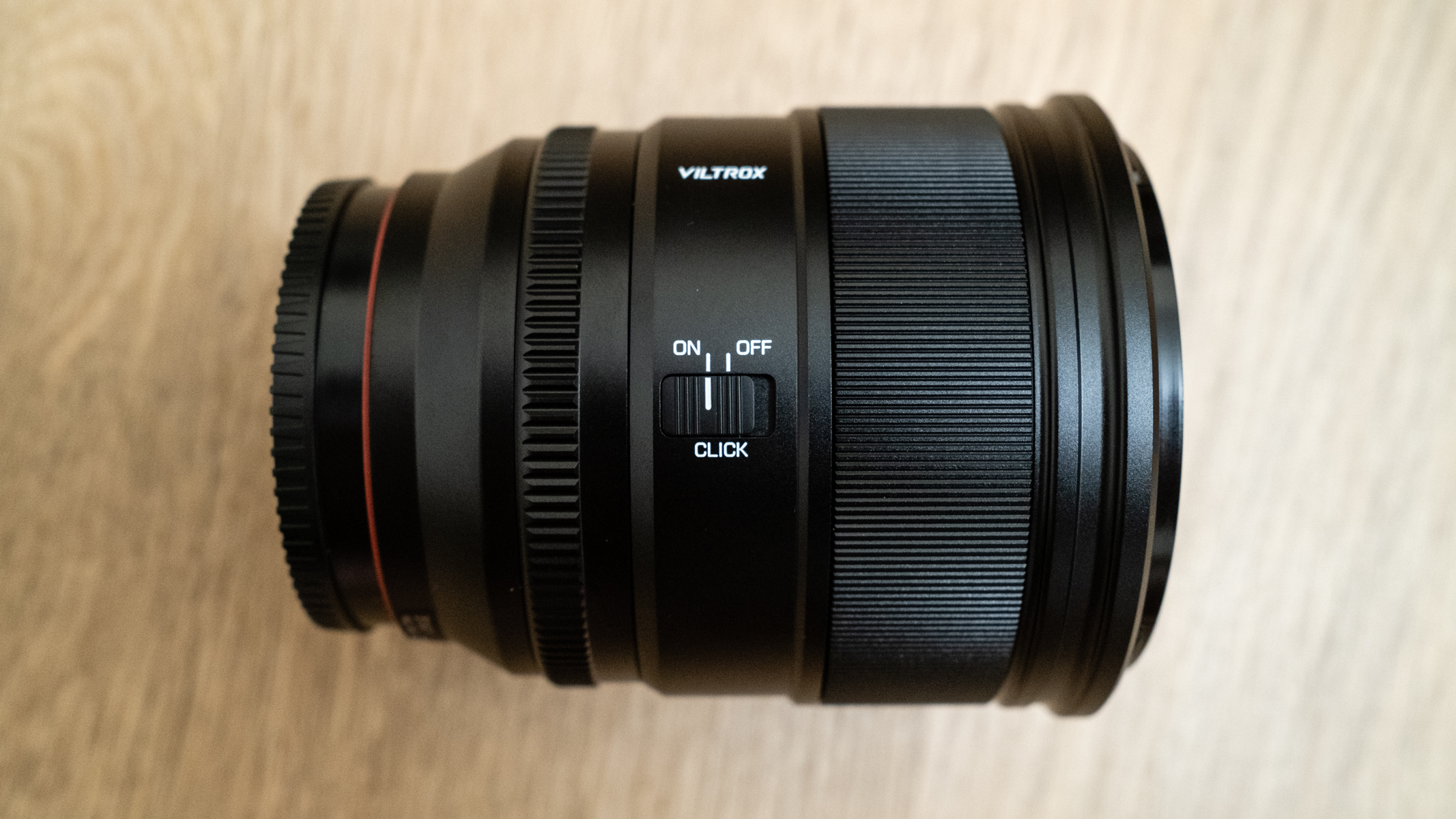 Viltrox AF 27mm f/ 1.2 Pro side view showing aperture click switch
