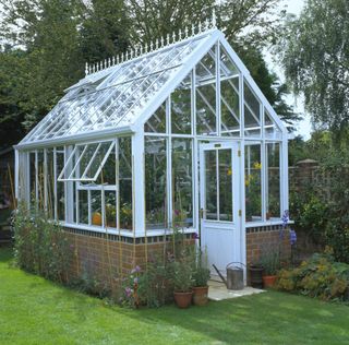 Victorian style greenhouse with an apex roof