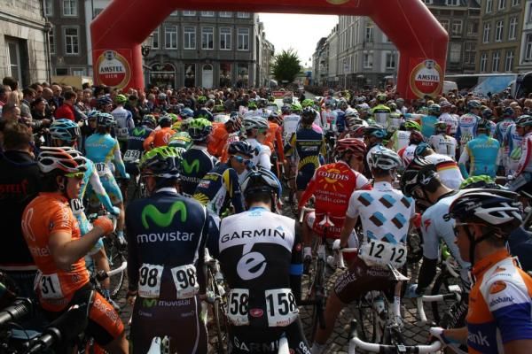 The riders line-up for the start