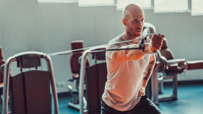 Man exercising with a resistance band