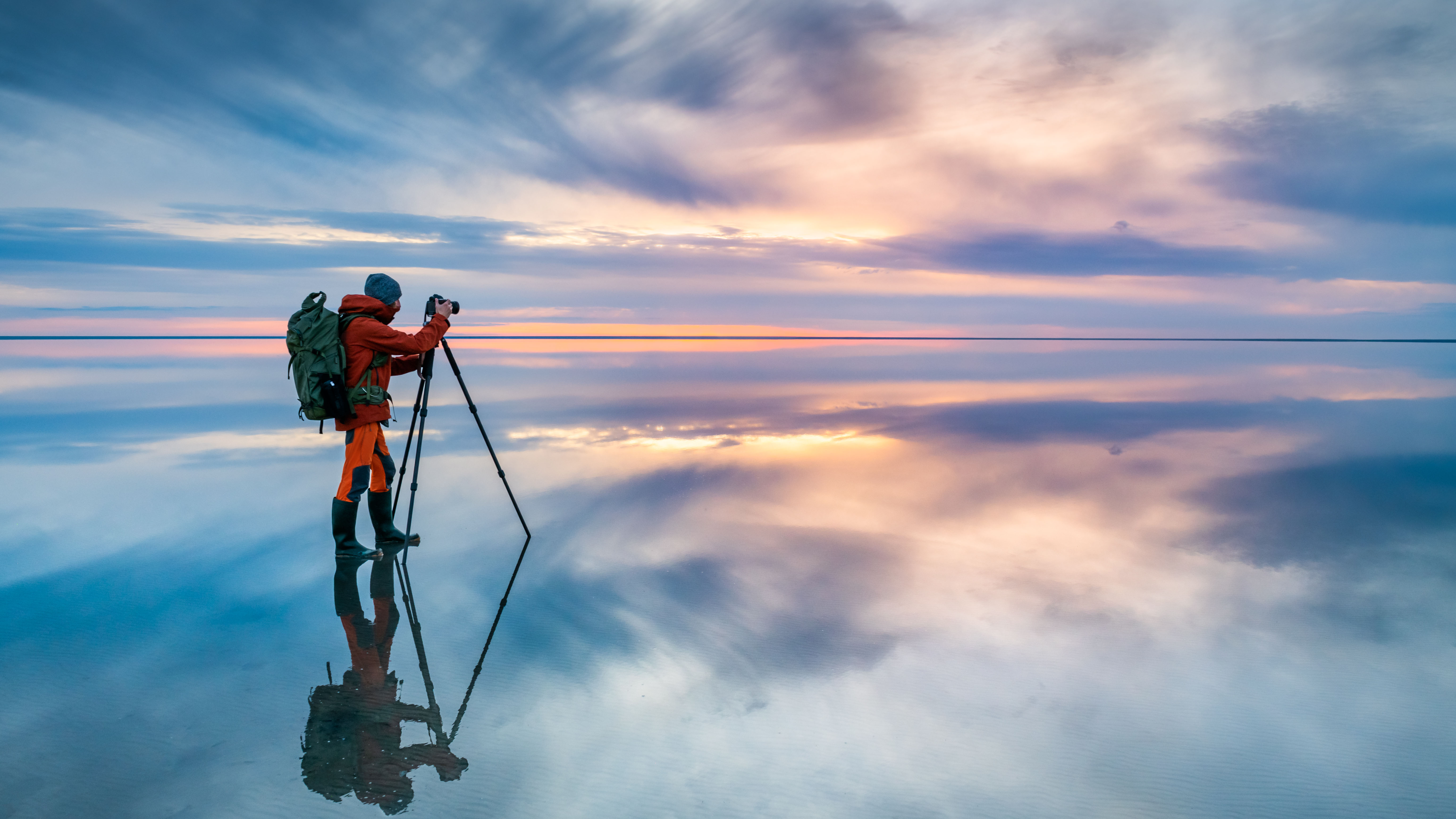 Photographer taking photo at sunset.