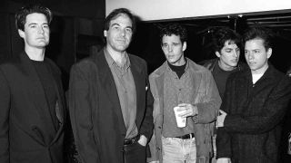 Director Oliver Stone at The Doors movie premiere in 1991 with members of the cast