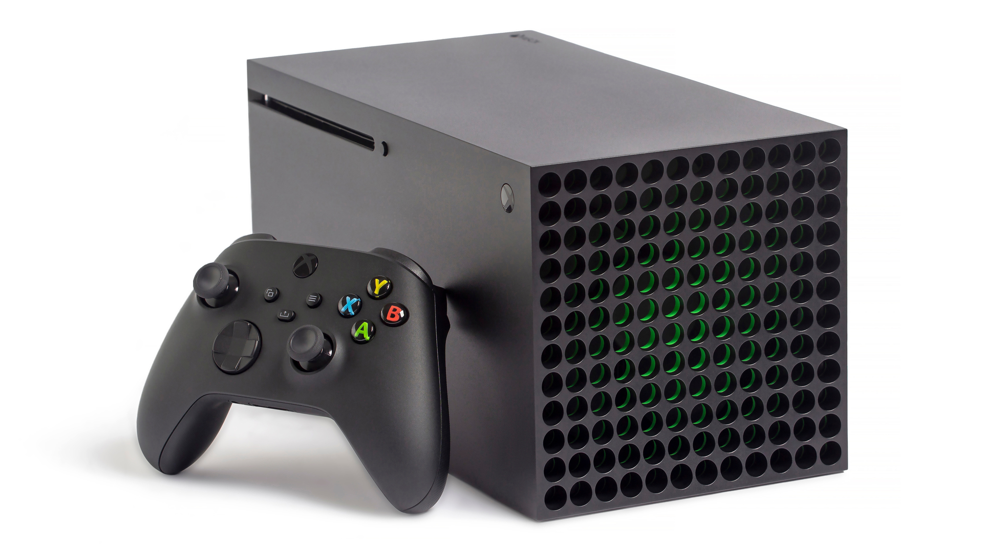 Xbox Series X лежит на боку, к нему прислонен контроллер
