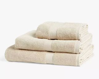 John Lewis ANYDAY Light Cotton Towels in beige folded and stacked