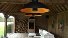 Overhanging patio heater in open barn