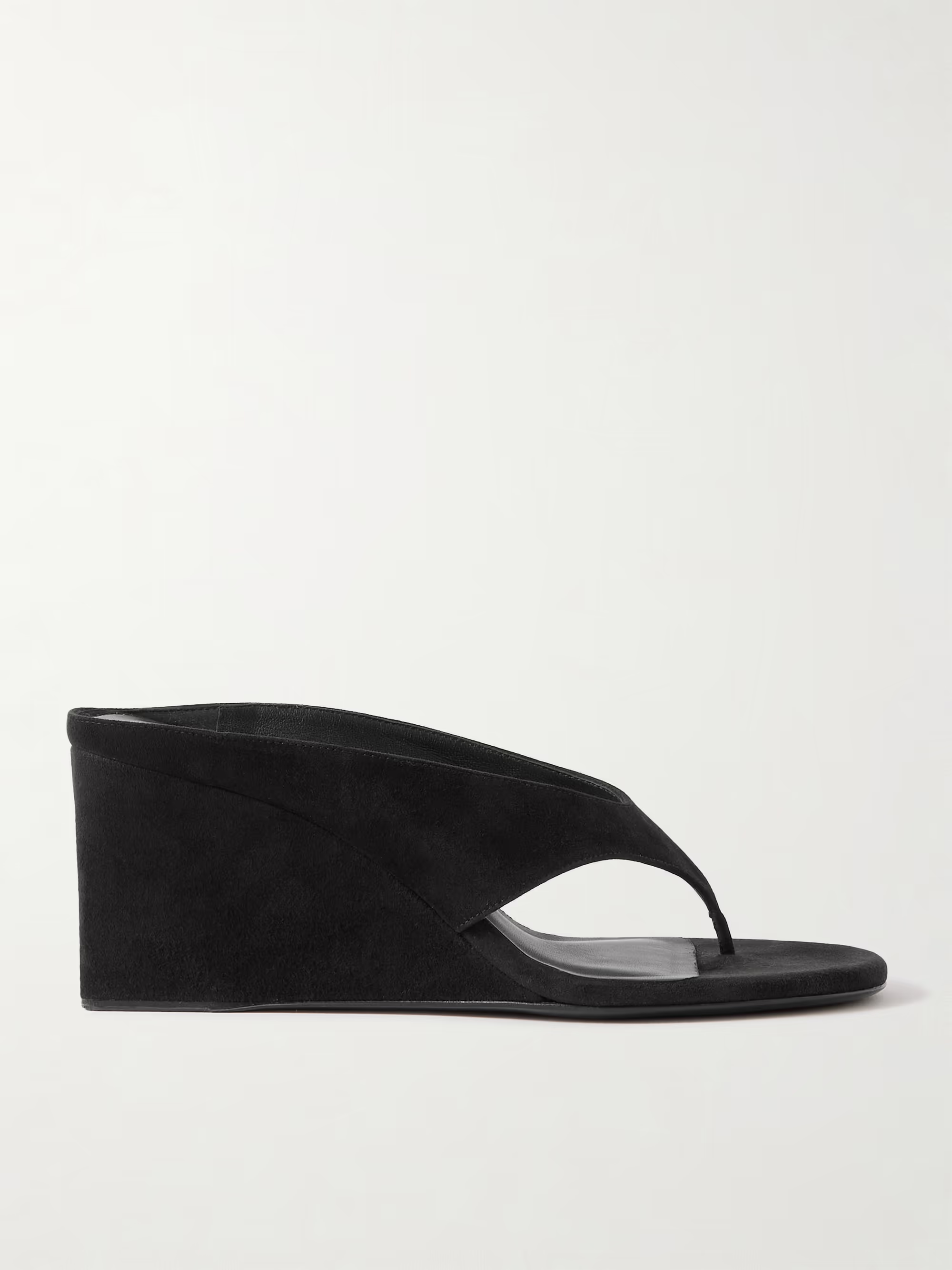 A pair of Ala&amp;iuml;a black thong wedge sandals.