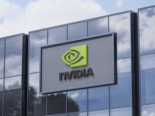 NVIDIA corporate building featuring bold 3D red NVIDIA logo under bright blue sky, symbolizing innovation and electric vehicle dominance in the global stock market